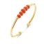 Victoria Gold-colored bracelet with red beads